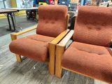 two recliners that are sitting on a wooden floor