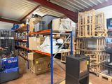a large warehouse filled with lots of boxes and pallets