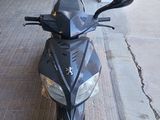 a motorcycle that is parked on the side of the street