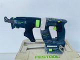 a close up of two electric tools in a box on a table