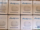 six boxes of small white electronic devices sitting on top of a table