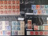 many different types of stamps on display in a glass case