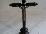 a cross with a crucif on it on a table