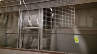 a large metal cage with a bunch of items inside of it