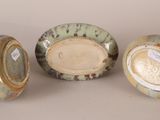 three different types of ceramic bowls sitting next to each other on a table