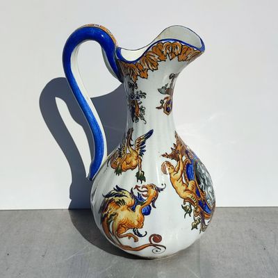 a white and blue vase sitting on a table