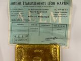 an image of a piece of gold sitting on top of a piece of paper