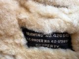 a close up of a teddy bear with a label on it ' s back