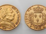 two gold sovereigns, one of which has a crown and the other of which is a crown