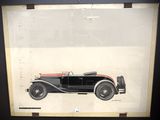 une vieille photo d'une voiture noire et rouge dans un cadre noir