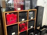 many boxes on a shelf in a room