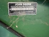 a sign on the side of a green machine