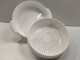 a white bowl and a white bowl on a table