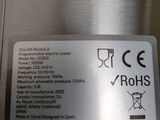 a close up of a label on a stainless steel refrigerator