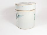 a white container with a bird design on it