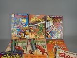 a lot of comic books sitting on a table