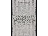 a black and white photo of a rug with a pattern on it