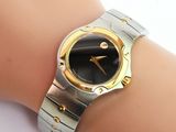 an image of a woman ' s wrist with a watch on it