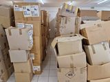 many boxes stacked on top of each other in a room