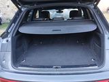 the back of a car with the trunk open and the back of the car in the back