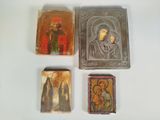 three small wooden plaques with religious images on them on a white surface