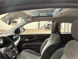 the interior of a car with a view of a parking lot from the passenger seat