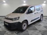 the white van is parked on a checkered floor in a garage