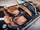 a black and tan convertible car with tan leather seats