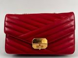 a red leather clutch bag with a gold clasp