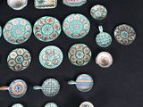 many different types of tea cups and saucers on the table