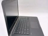a laptop that is sitting on a white surface