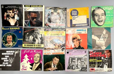 several different records are stacked on top of each other on a table