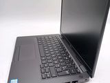 a laptop with a black keyboard on a white surface