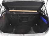 a trunk of a car with a wooden board in it