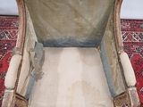 a chair that is sitting on a rug on the floor