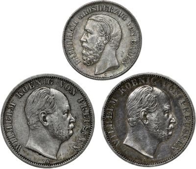 three silver coins with a man and a woman on them