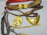 several different types of belts and other items on a table