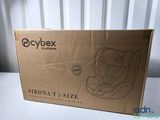 a box with a baby seat in it sitting on a table