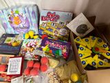 a box full of toys and other items on a table