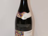 a bottle of wine that is sitting on a table