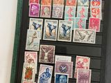 a picture of a collection of stamps on a black book