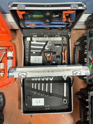 many tools in a tool case on the floor