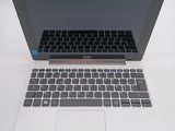 a laptop that is sitting on a table with a keyboard