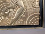 a picture of a gold art deco painting on a wall