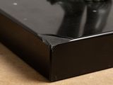 a close up of a black object on a table