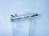 an image of a shower head with water coming out of it