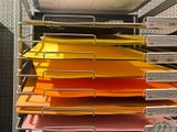 a lot of folders that are stacked on a shelf