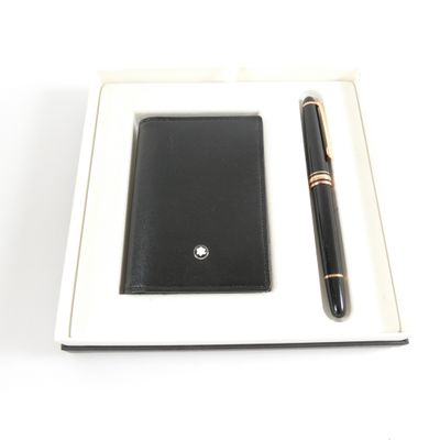 wallet and pen in a box on a white surface with a white background