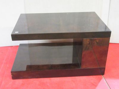 an image of a glass coffee table on a red floor