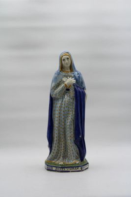 figurine of the virgin of guadalupe in blue and gold